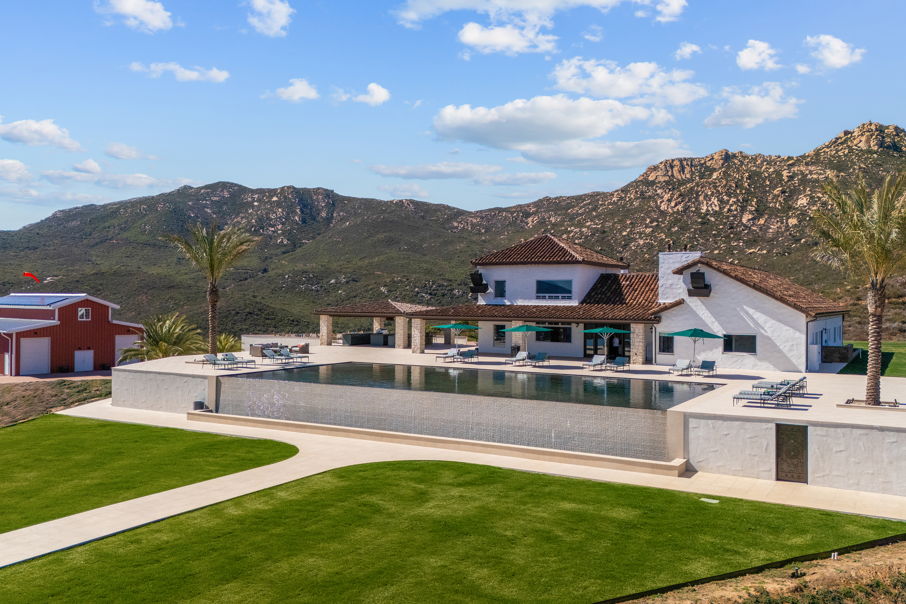 Infinity pool and main residence with Palomar mountain backdrop