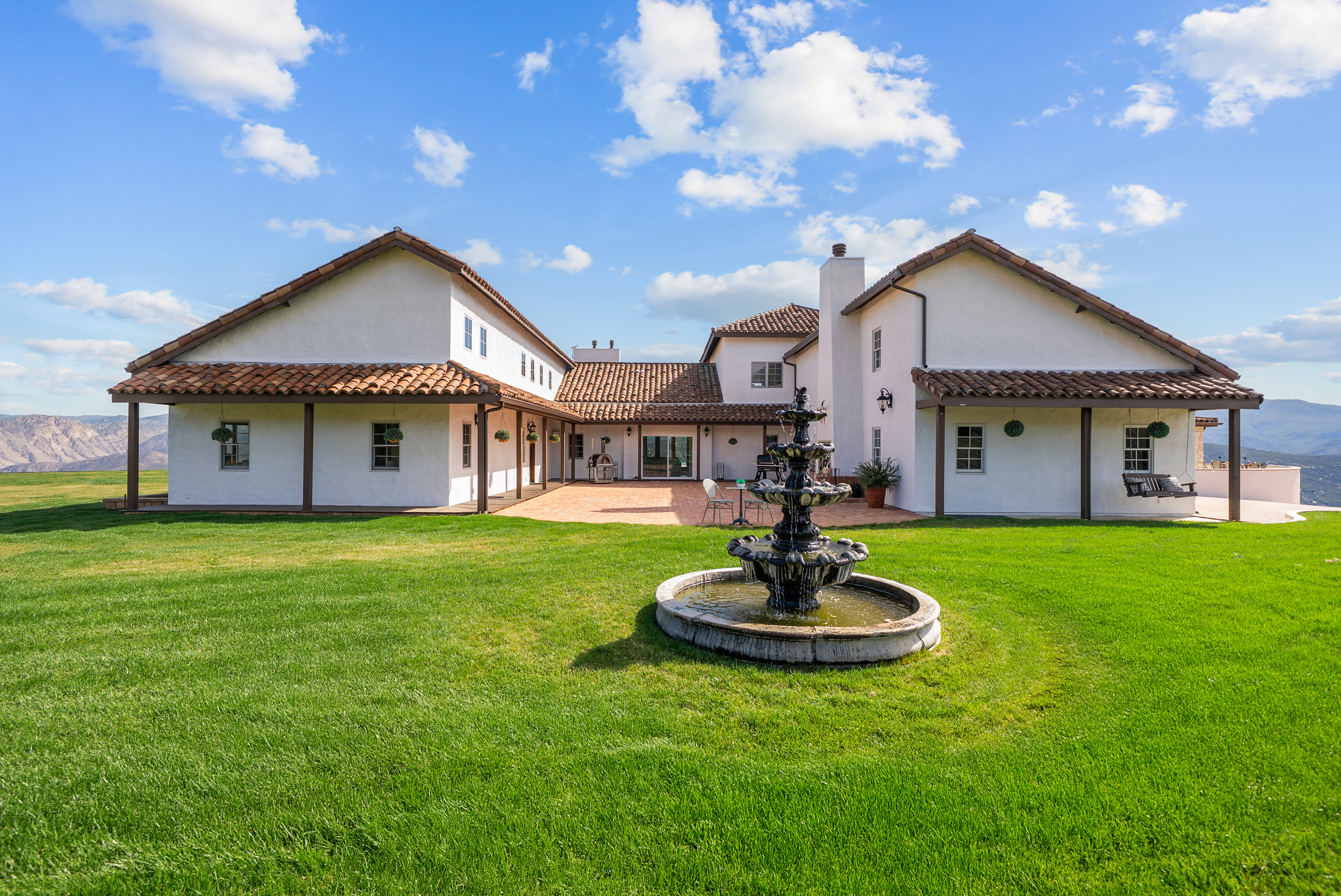 Rear lawn and fountain courtyard
