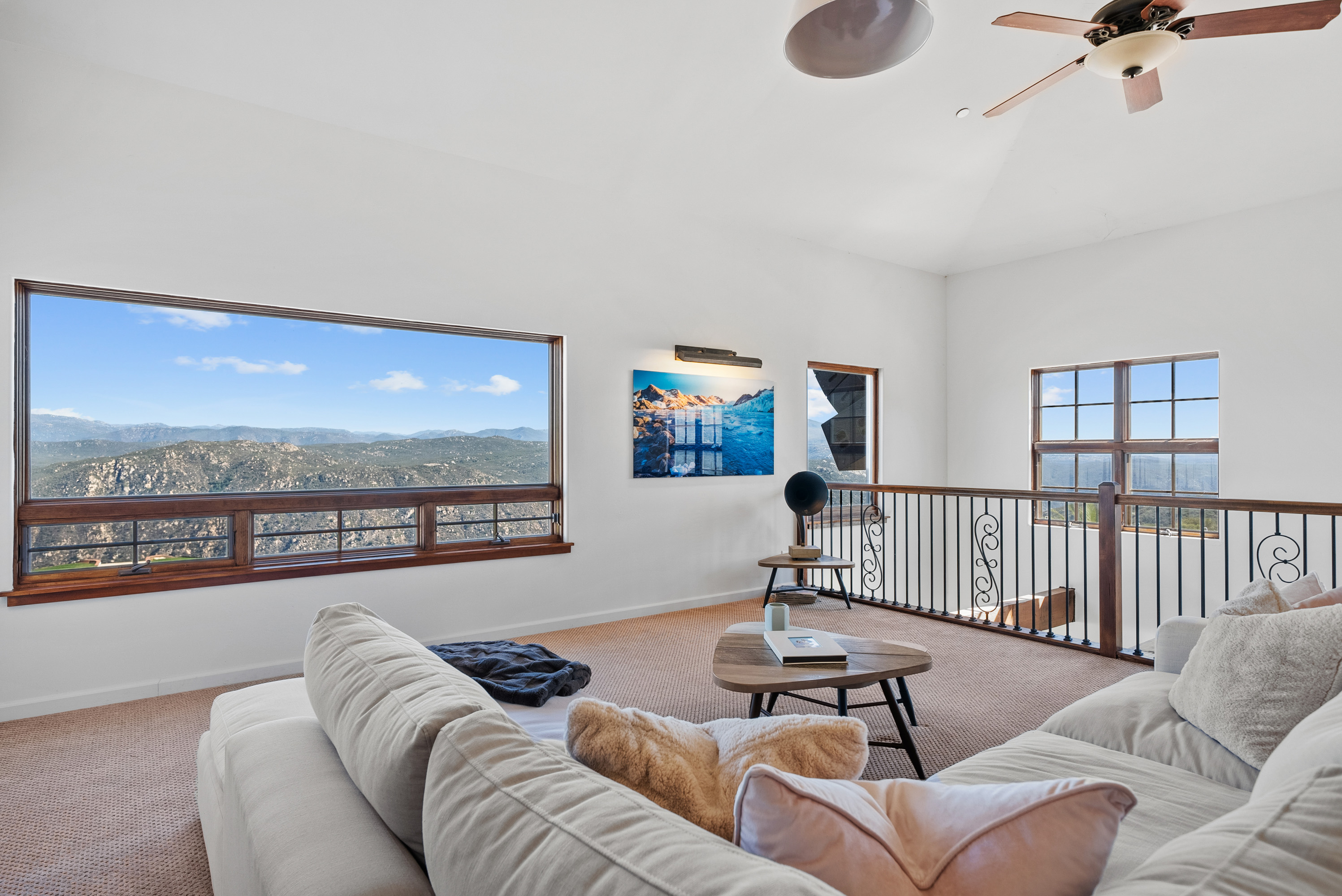Kitchen island with gas range and mountain views